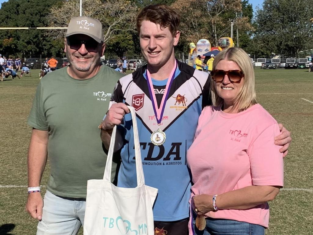 Gerry and Annmaree Black present Jordan Moffat with Norths reserve grade Player of the Match award at the inaugural TBMMBEKIND Day at the Gymmy Grounds, Rockhampton, on July 20, 2024.