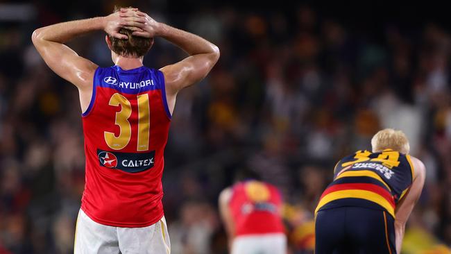 Harris Andrews and Elliott Himmelberg after the siren. Picture: Sarah Reed/AFL Photos via Getty Images