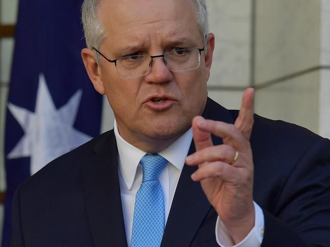 CANBERRA, AUSTRALIA - DECEMBER 11: Prime Minister Scott Morrison reacts during a press conference in the Prime Ministers courtyard on December 11, 2020 in Canberra, Australia. Clinical trials of a COVID-19 vaccine being developed by the University of Queensland in partnership with biotech company CSL will be abandoned, after the Federal Government had committed to purchasing, and agreements had been made to secure 51 million doses of the vaccine. (Photo by Sam Mooy/Getty Images)