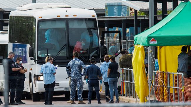 Australian evacuees arrive at the former Inpex workers’ camp in Howard Springs yesterday to spend two weeks in quarantine after leaving the Diamond Princess Cruise Ship moored in Japan. Picture: AAP/Helen Orr