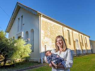 TWO CHANGES: Bree Dahl with her new baby Ivy in front of the historic Oddfellows Hall she purchased at auction and will renovate into a house. Picture: Adam Hourigan