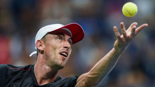 John Millman serves on his way to beating Roger Federer on Tuesday. Picture: AFP