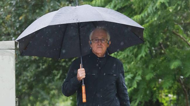 28/11/18: Former PM, Malcolm Turnbull walks in the rain near his home at Point Piper, Sydney. John Feder/The Australian.