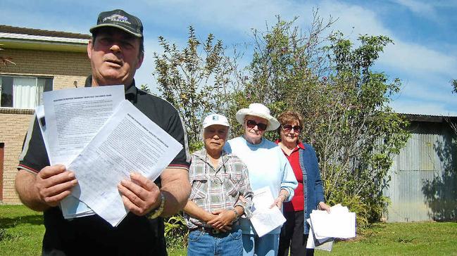 Bill Daniels holds a petition opposed to a new crematorium in Grafton. Supporting him are Peter Lee, Claire Lee and Daphne Batson.