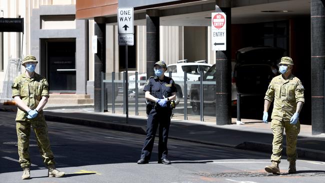 ADELAIDE, AUSTRALIA - NewsWire Photos - NOVEMBER 25, 2020 - Military personnel stand guard at Peppers Waymouth Street Hotel in the CBD where the Parafield cluster originated. Picture: NCA NewsWire / Naomi Jellicoe