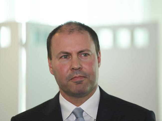 Australian Treasurer Josh Frydenberg reacts during a signing ceremony for a Memorandum of Understanding at Parliament House in Canberra, Monday, November 5, 2018. (AAP Image/Lukas Coch) NO ARCHIVING