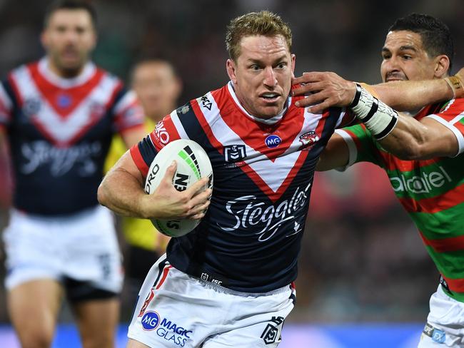 Roosters second-rower Mitchell Aubusson fends off South Sydney's Cody Walker in an NRL game last season. Both are Northern Rivers products. Picture: Joel Carrett