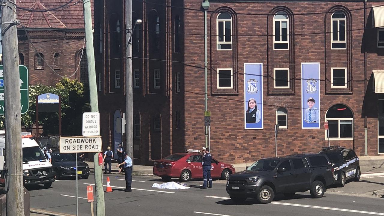 A Twitter user posted this picture of the police incident in Arncliffe, showing the attacker’s body covered by a sheet.