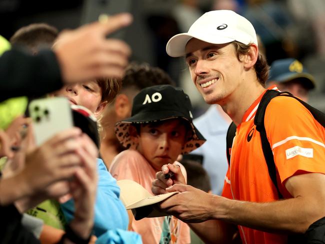 MELBOURNE, AUSTRALIA - JANUARY 19: Alex de Minaur of Australia interacts with fans after winning his round three singles match against Flavio Cobolli of Italy during the 2024 Australian Open at Melbourne Park on January 19, 2024 in Melbourne, Australia. (Photo by Kelly Defina/Getty Images)