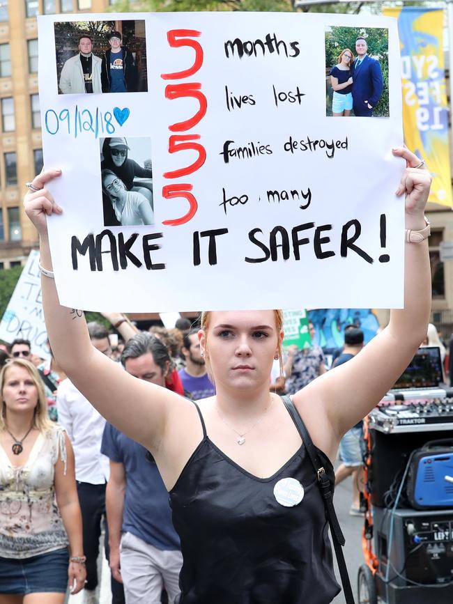 Protester Hayley Sheers holds a sign demanding action at a Sydney rally in support of pill testing earlier this year. Picture: Damian Shaw