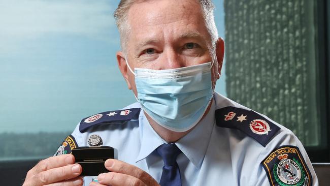 Police Commissioner Mick Fuller with the NRL Premiership ring he helped design. Picture: Richard Dobson