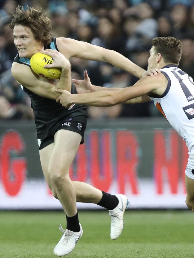 Jared Polec pushes off Zac Langdon. Picture Sarah Reed