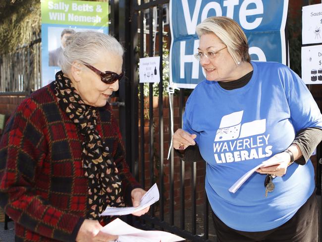 Waverley Mayor Sally Betts talks to voters at Rose Bay Secondary College. Picture: AAP