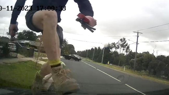 The man jumped on the front bonnet before stomping on the roof of the car.