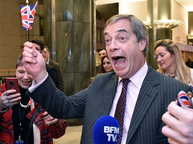 Britain's Brexit Party leader Nigel Farage waves a Union flag as he speaks to the press after the European Parliament ratified the Brexit deal in Brussels. Picture: AFP