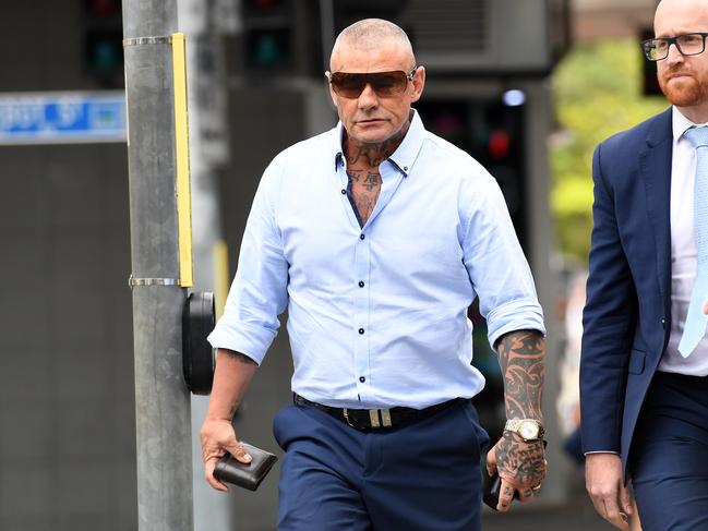 Convicted armed robber, dubbed “The General” of the infamous Angry Gang, Allan McQueen (left) arrives at the Coroners Court in Brisbane for the inquest. Picture: AAP Image