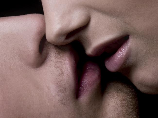 Portrait of a hot young couple kissing