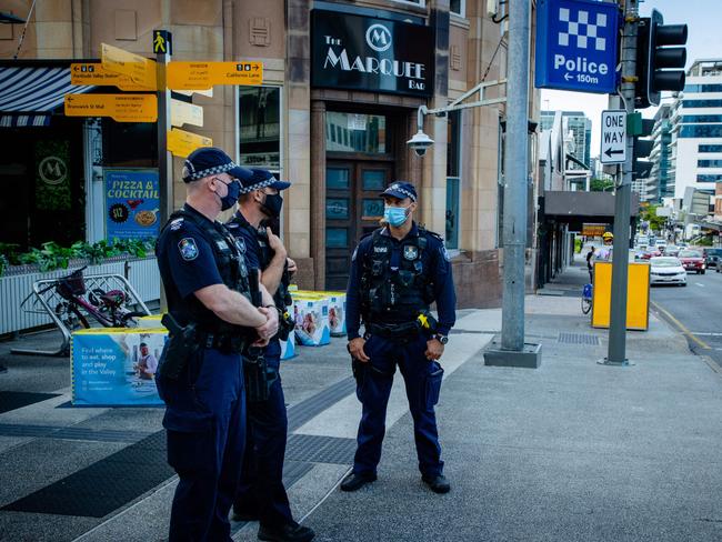 Police officers patrol the Valley Mall in Brisbane on March 29, 2021 as more than two million people in the city entered a three-day lockdown after a cluster of coronavirus cases was detected in Australia's third-biggest city. (Photo by Patrick HAMILTON / AFP)