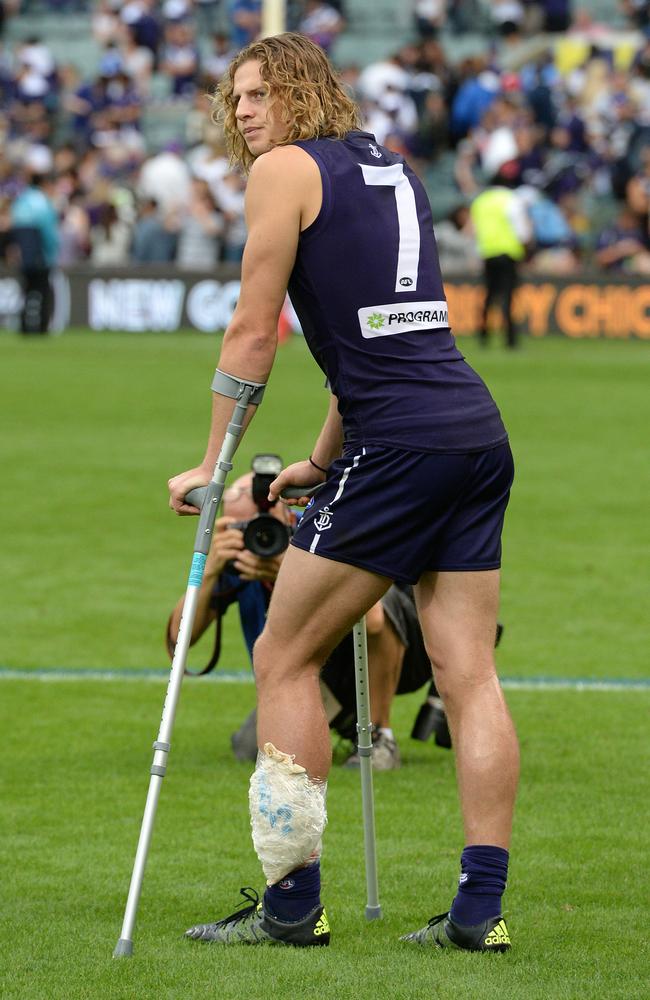 Nat Fyfe on crutches after the game. Picture: Daniel Wilkins