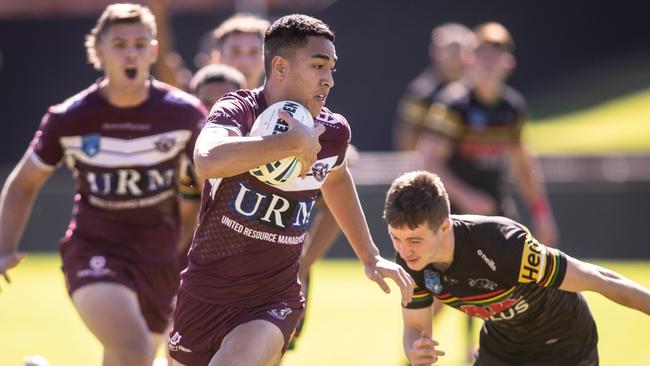 A youngster with a will known name. Manly's Lehi Hopoate on his way to scoring a try.