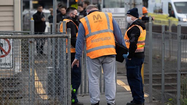 Metro Trains staff investgate following a collision between a car and a train near Spotswood railway station on July 7. Picture: Tony Gough