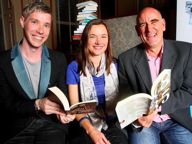 A jubilant Rohan Wilson with fellow Tasmanian Literary Prize winners Katherine Johnson and James Boyce in 2013, when he took out the Margaret Scott Prize.