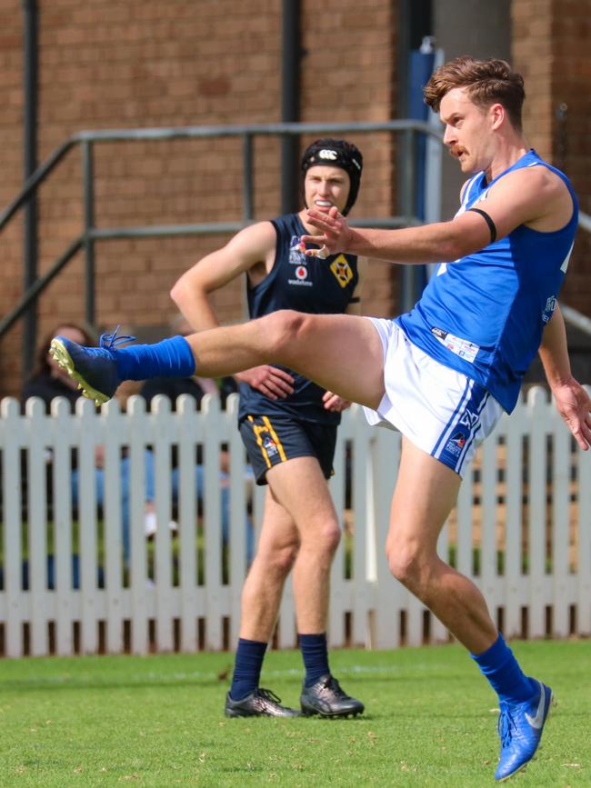 Athelstone's Luke Rander kicks for goal during the Raggies' win over Scotch Old Collegians on Saturday. Picture: Brayden Goldspink