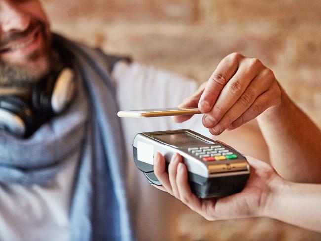 Cash is increasingly on its way out in Australia, replaced by digital transactions and mobile wallets. Picture: iStock