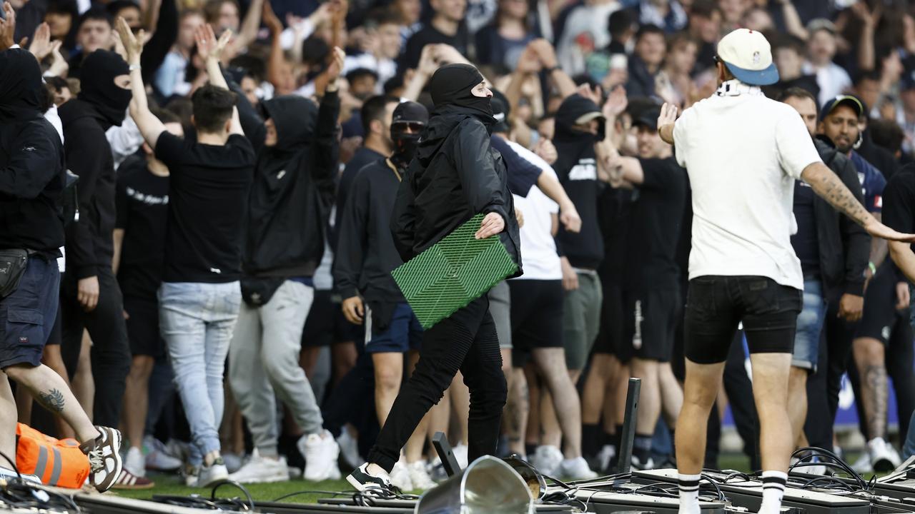 Melbourne Victory fans storm the pitch. Picture: Darrian Traynor/Getty
