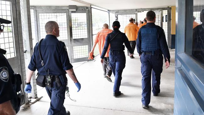 Prisoners and officers move through the Woodford Correctional Centre. Picture: Patrick Woods.