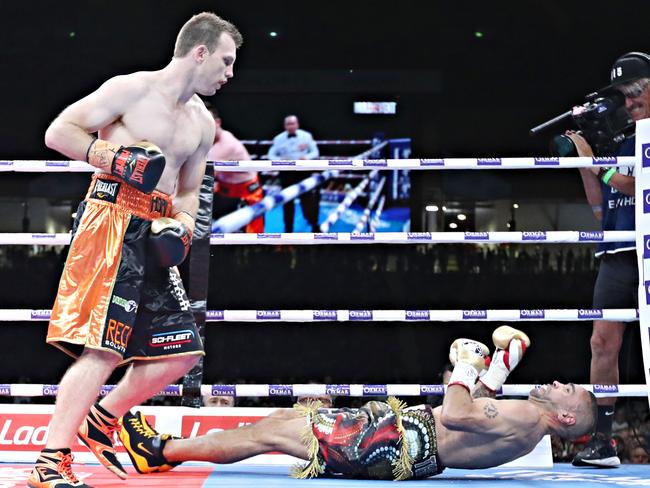 Jeff Horn irons out Anthony Mundine with a left hook in the first round. Picture: Annette Dew