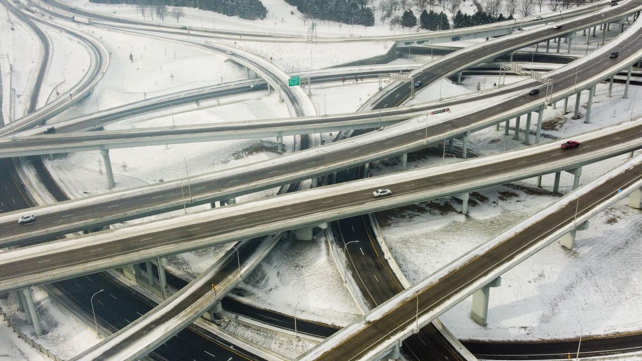 Vehicles move along a highway in Louisville, Kentucky, under freezing temperatures on December 23, 2022. (Photo by LEANDRO LOZADA / AFP)