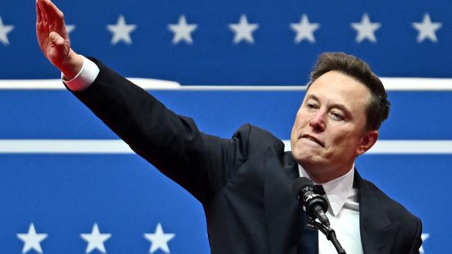 Tesla and SpaceX CEO Elon Musk gestures as he speaks during the inaugural parade inside Capitol One Arena, in Washington, DC, on January 20, 2025. (Photo by ANGELA WEISS / AFP)