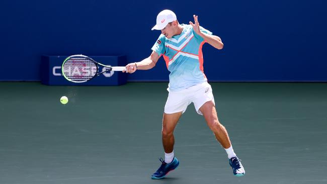 Alex de Minaur thumps a forehand on the way to a maiden grand slam quarterfinal