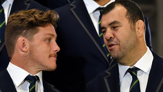 Wallabies coach Michael Cheika (right) with captain Michael Hooper at Friday’s World Cup squad announcement. Picture: AFP