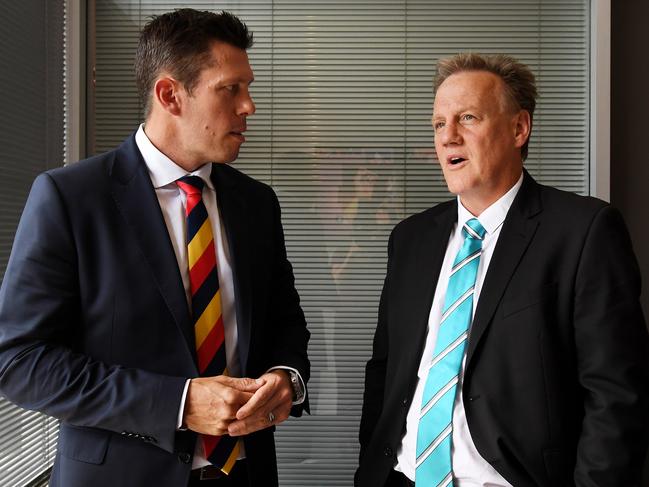 Adelaide Football Club CEO Andrew Fagan and Port Adelaide Football Club CEO Keith Thomas pose for photographs at an announcement for Variety at the Children'€s Charity of South Australia in Adelaide, March 7, 2018. (AAP Image/Tracey Nearmy) NO ARCHIVING,