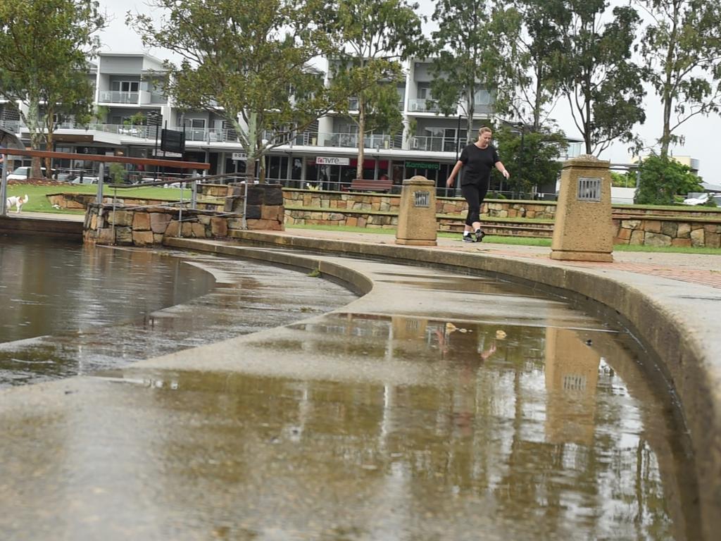 Lake Eden in North Lakes is slowly creeping up its steps with the water nearly reaching the walkway. Picture: Marcel Baum.