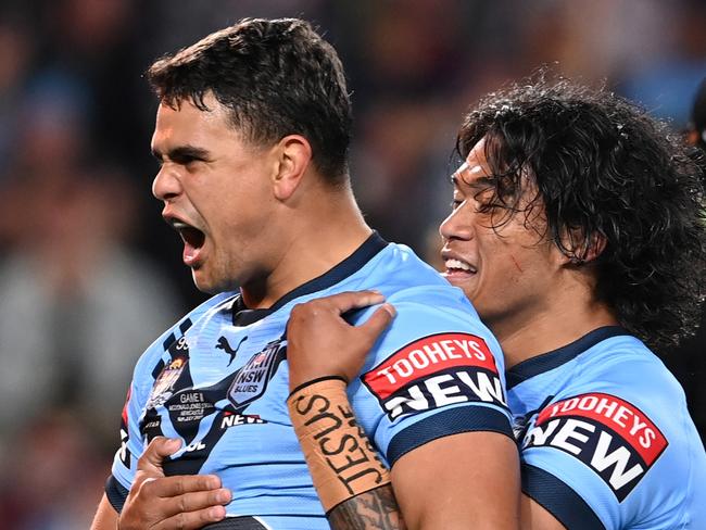 GOLD COAST, AUSTRALIA - JULY 14:  Latrell Mitchell of the Blues celebrates with Brian To'o of the Blues after scoring a try during game three of the 2021 State of Origin Series between the New South Wales Blues and the Queensland Maroons at Cbus Super Stadium on July 14, 2021 in Gold Coast, Australia. (Photo by Bradley Kanaris/Getty Images)