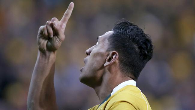 Israel Folau celebrates scoring another try for the Wallabies. Picture: AP 