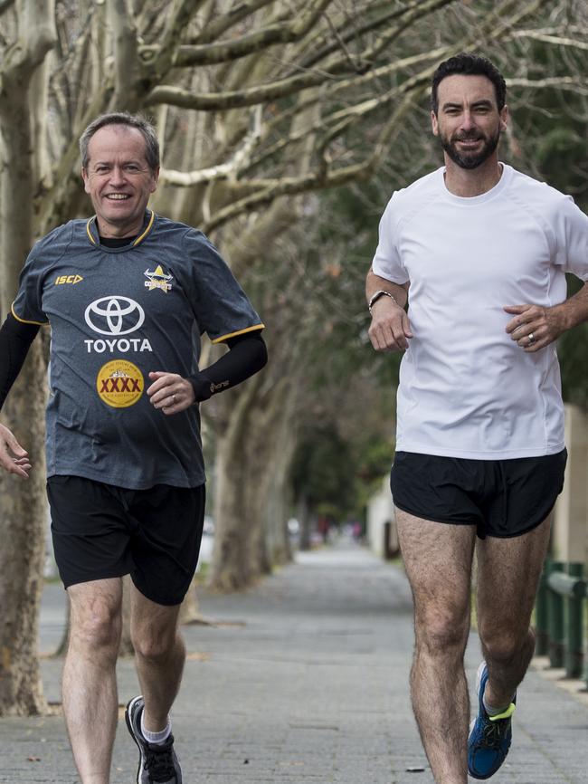 Labor leader Bill Shorten taking a run with member for Perth Tim Hammond.