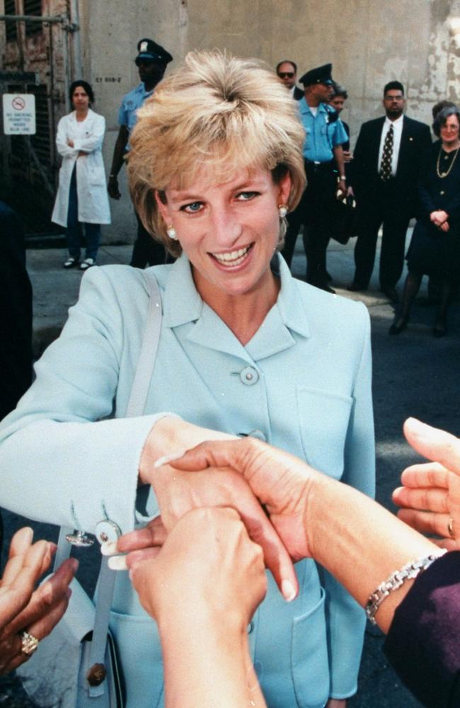 Princess Diana shaking hands with people on a street during a visit to the US. Photo: Ken Goff/The LIFE Images Collection/Getty Images