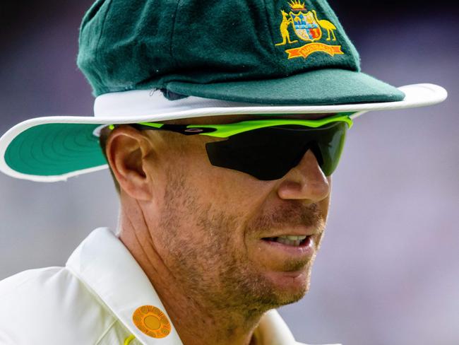 Australia's David Warner looks on during day one of the first cricket Test match between Australia and South Africa at the Gabba in Brisbane on December 17, 2022. (Photo by Patrick HAMILTON / AFP) / - IMAGE RESTRICTED TO EDITORIAL USE - STRICTLY NO COMMERCIAL USE-