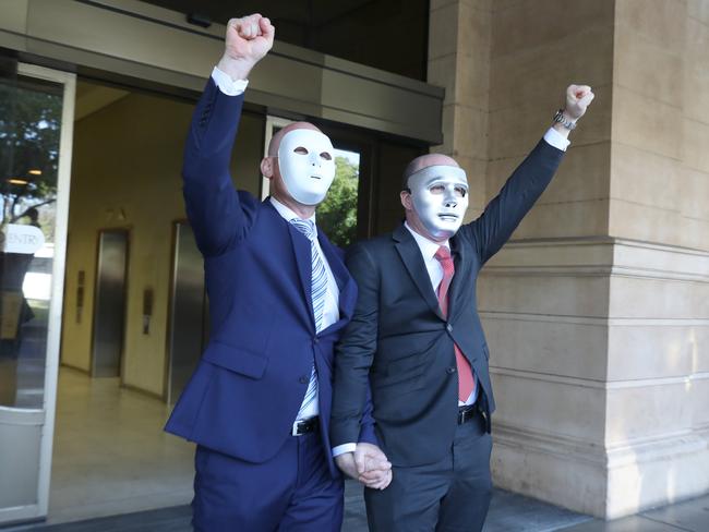 Brothers "A"(L) and "B" leave the District Court following the sentencing of child sex offender Vivian Frederick Deboo. 4 December 2018. Picture Dean Martin