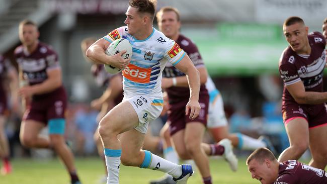 SYDNEY, AUSTRALIA - SEPTEMBER 19: Alexander Brimson of the Titans makes a break to score a try during the round 19 NRL match between the Manly Sea Eagles and the Gold Coast Titans at Lottoland on September 19, 2020 in Sydney, Australia. (Photo by Matt King/Getty Images)