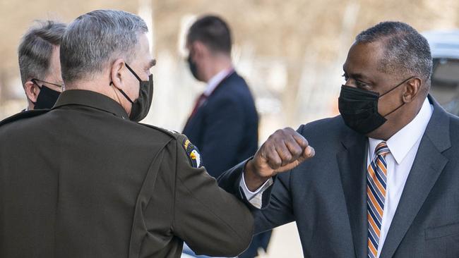 Mark Milley, chairman of the Joint Chiefs of Staff, greets Lloyd Austin outside the Pentagon last week. Picture: AFP