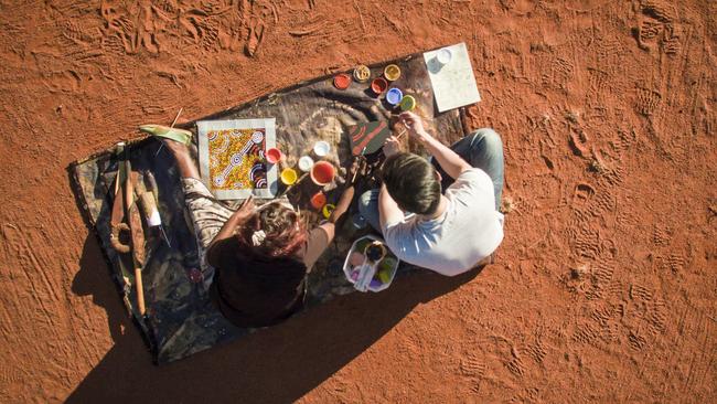 Dot-painting with Maruku Arts, Voyages Ayers Rock Resort, Uluru. Picture: Tourism NT