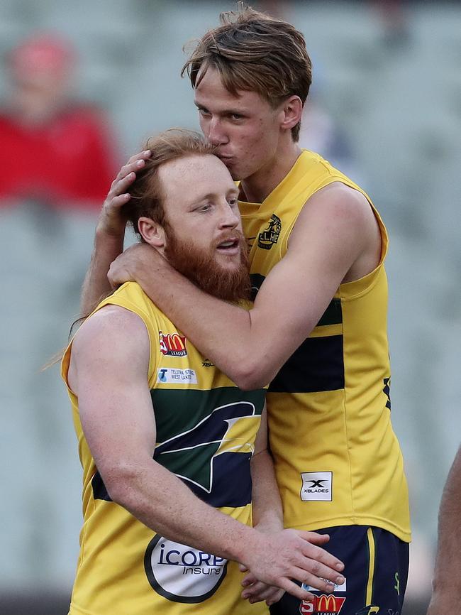 Jack Lukosius gives Angus Poole a kiss on the head after Poole's second goal. Picture Sarah Reed