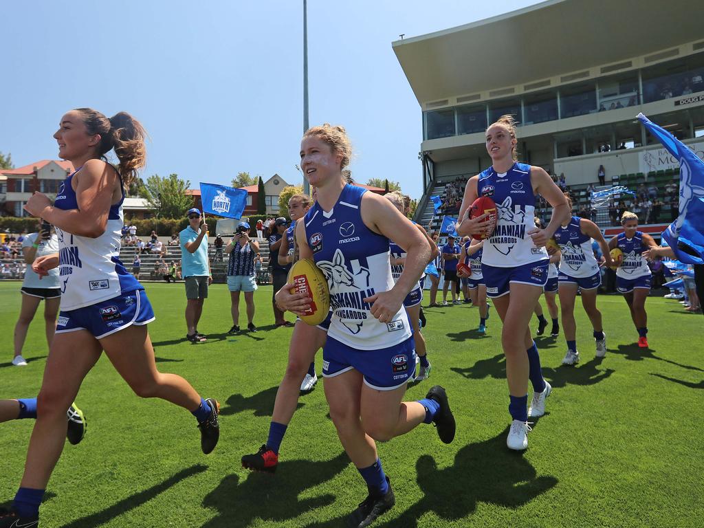 North Melbourne run out for their first match at the AFLW match between North Melbourne and Carlton at North Hobart Oval. Picture: LUKE BOWDEN