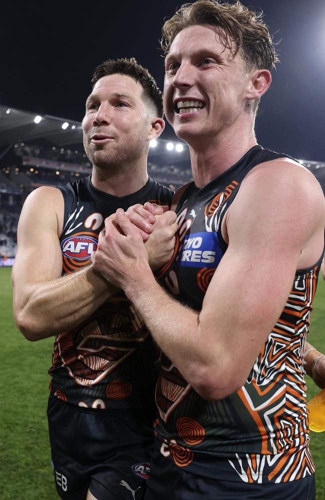 Toby Greene celebrates with Lachie Whitfield after the side’s thrilling win in Geelong on Saturday. Picture: Martin Keep/AFL Photos/Getty Images.