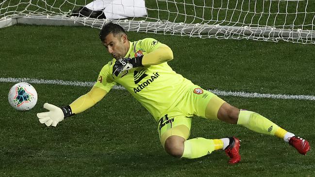 Brisbane goalkeeper Jamie Young pulls off a diving save against Sydney FC at McDonald Jones Stadium. Picture: Getty Images
